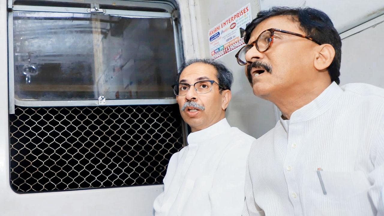 Uddhav Thackeray, president, Shiv Sena (UBT) and MP Sanjay Raut in the Bandra-bound train on Friday. Thackeray was accompanied by Shiv Sena leader Milind Narvekar. PIC/RAJENDRA B. AKLEKAR
