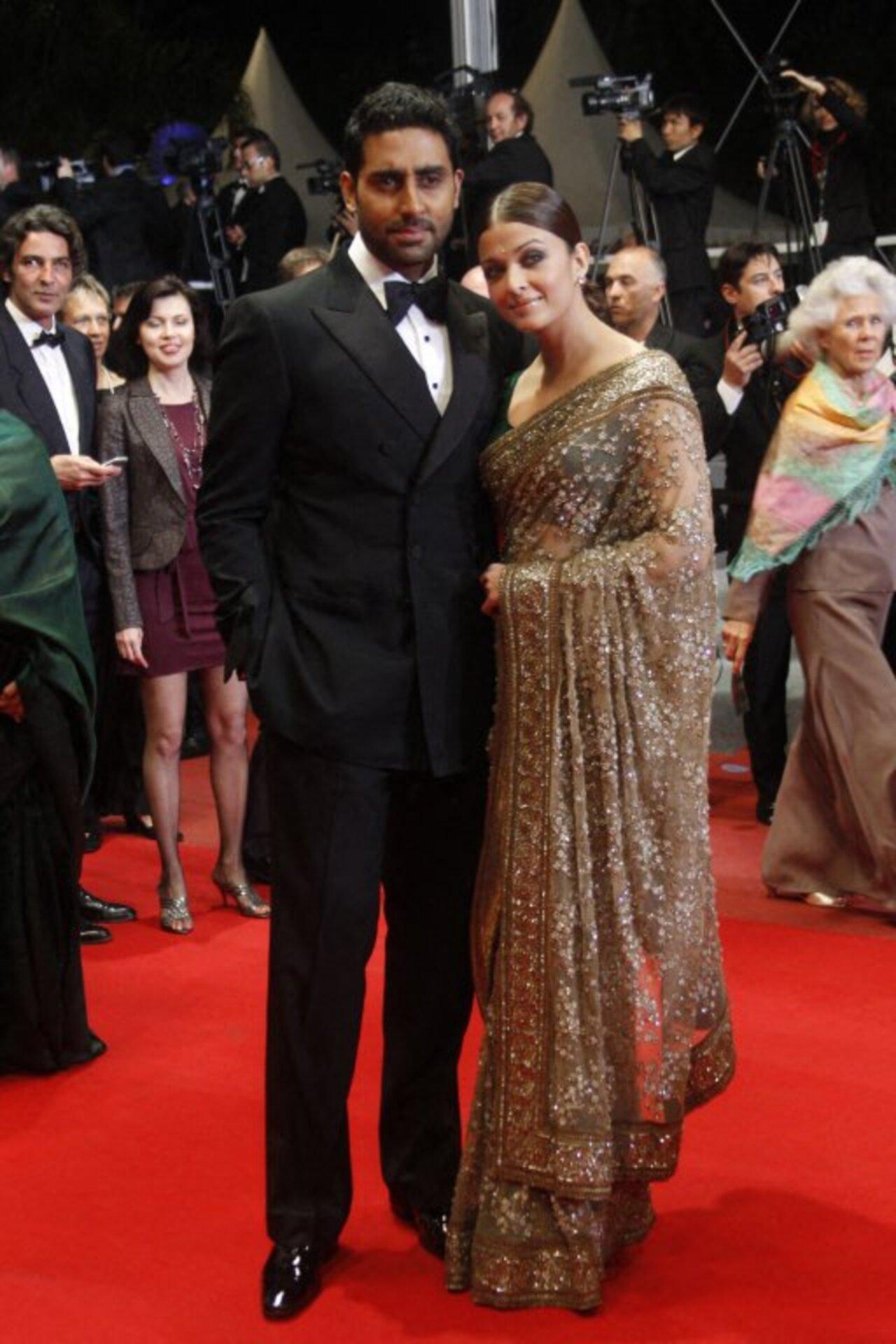 Aishwarya went for an ethnic ensemble and donned a sheer saree as she arrived with Abhishek for the screening of ‘Outrage’ at the 63rd Cannes Film Festival in 2010. 