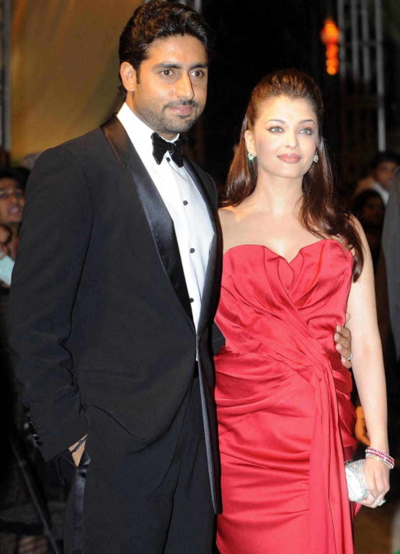 For the main ceremony, Aishwarya made headlines in a hot red strapless gown as she arrived with Abhishek. 