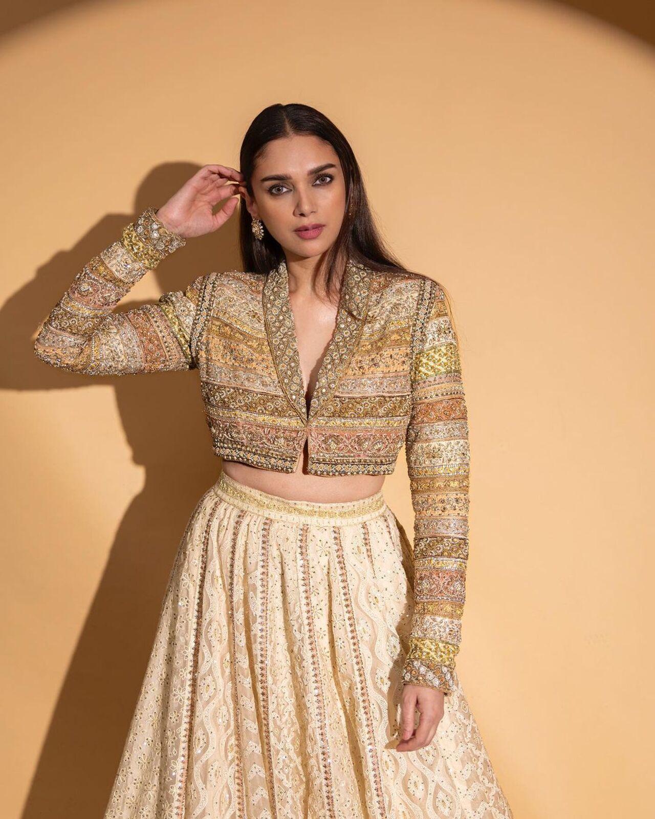 If you wish to go the fusion route, here’s one with a jacket-style blouse paired with a lehenga. 