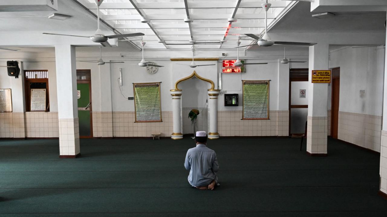 A Muslim religious scholar prays at the Jummah Masjid Mosque during the Islamic Holy month of Ramadan in Colombo