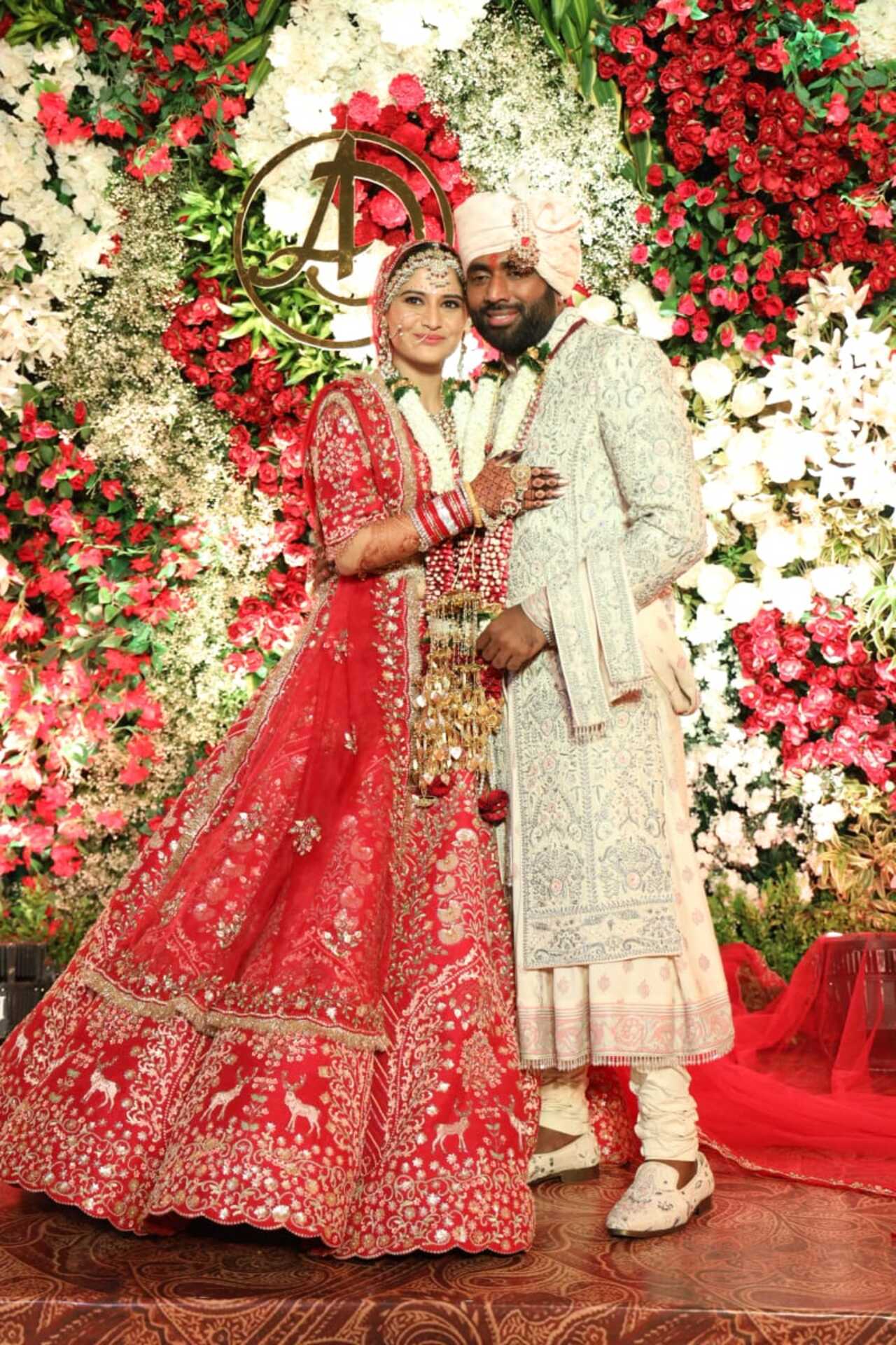 Newlyweds Arti Singh and Dipak Chauhan pose for the paparazzi after their phera ceremony