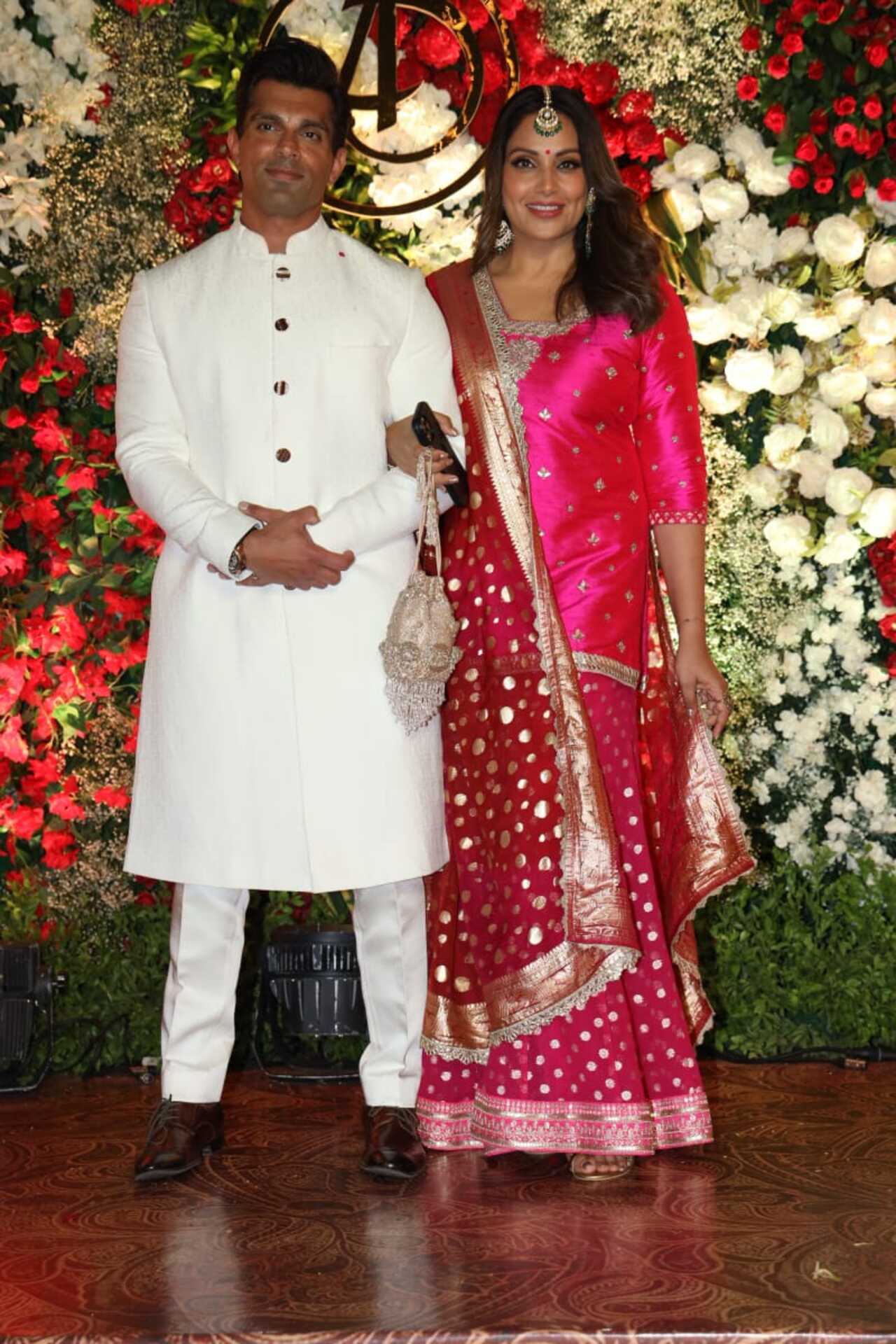 Karan Singh Grover and Bipasha Basu poses hand-in-hand at the wedding