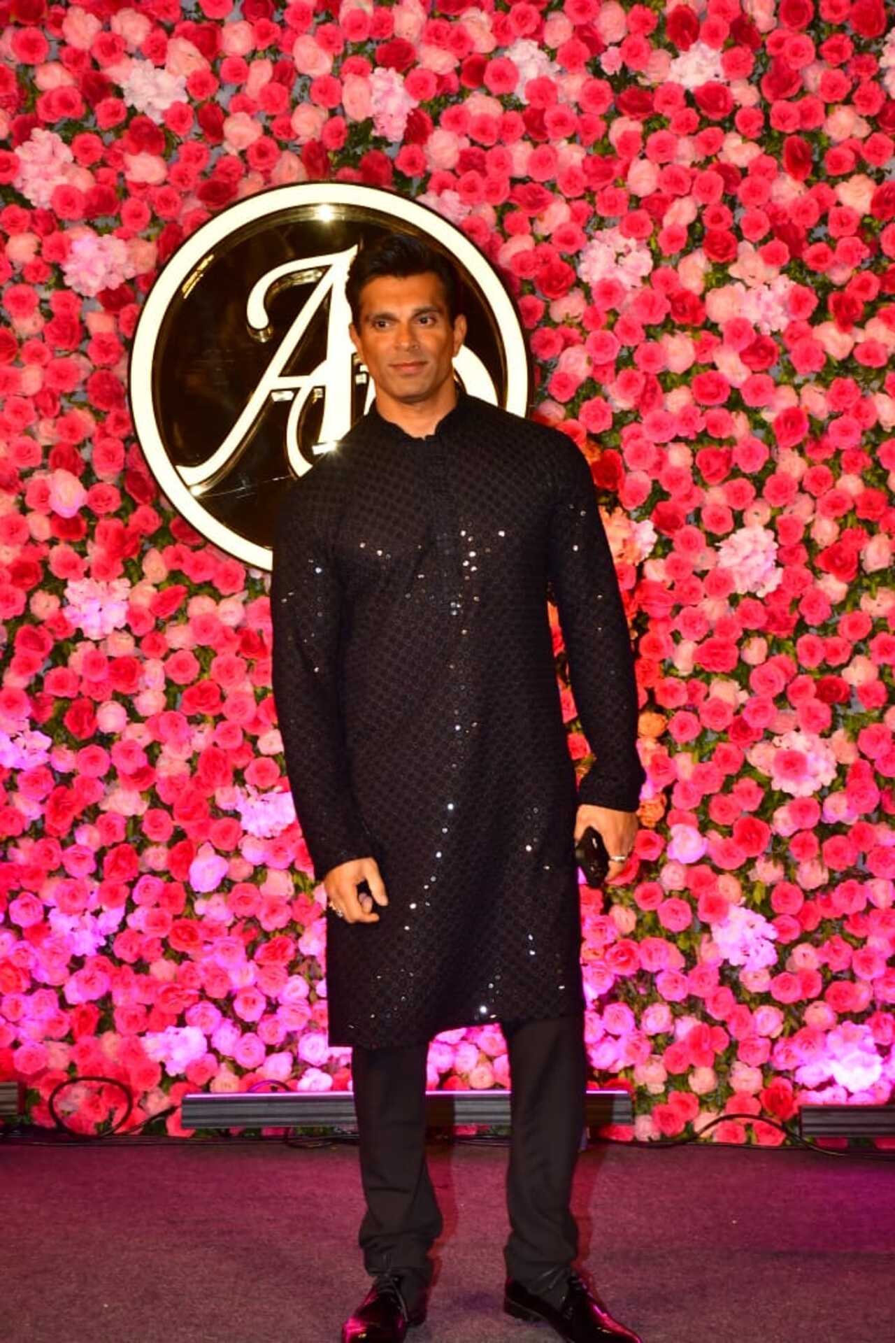 Actor Karan Singh Grover arrived in style wearing a black kurta pajama set. 