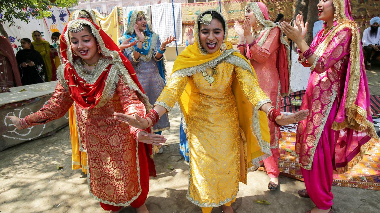 Women sing folk songs as they perform Giddha, the folk dance from Punjab during a fair. (ANI Photo/Raminder Pal Singh)
