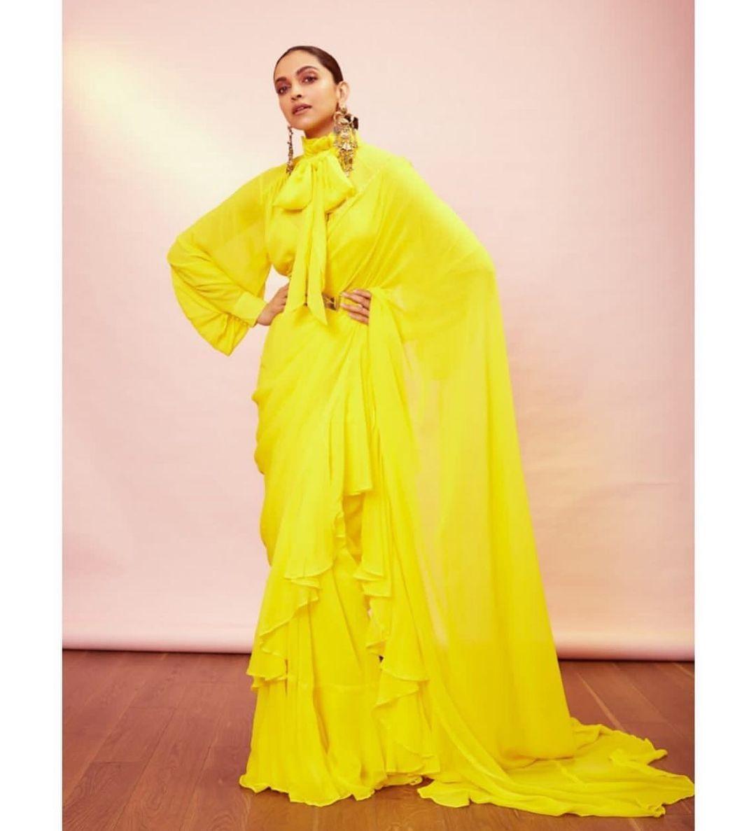 On the third day of Chaitra Navratri, consider wearing a vibrant yellow outfit like Deepika Padukone's. She chose a voluminous Sabyasachi saree in a cheerful pineapple yellow shade, ditching her usual power suits