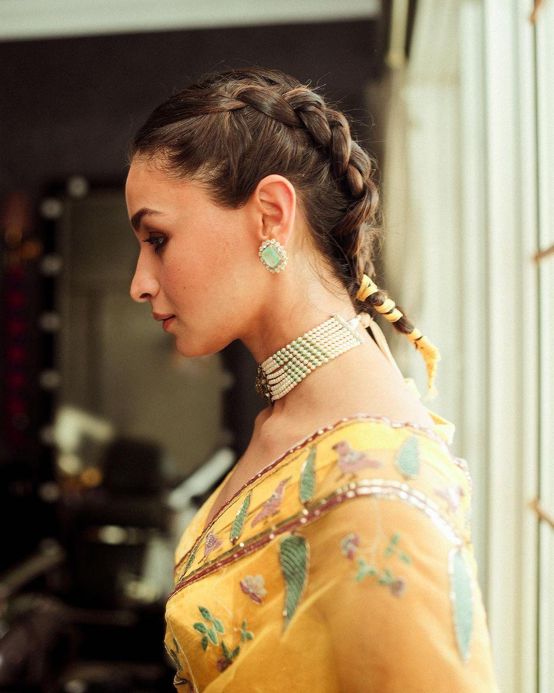 Completing her look, she adorned herself with a necklace and earrings. Alia styled her hair in a short braid for the photoshoot