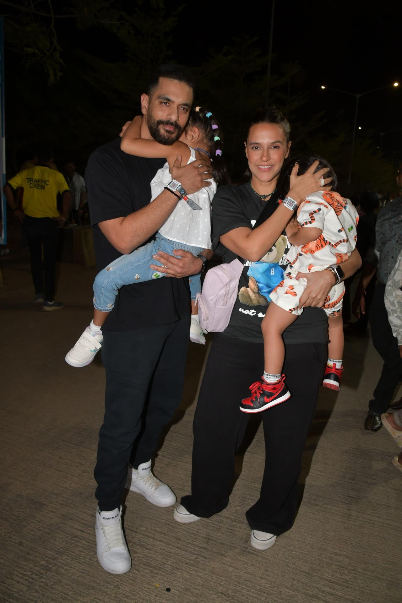 Angad Bedi and Neha Dhupia twinned in black and were seen with their kids Mehr and Guriq. 