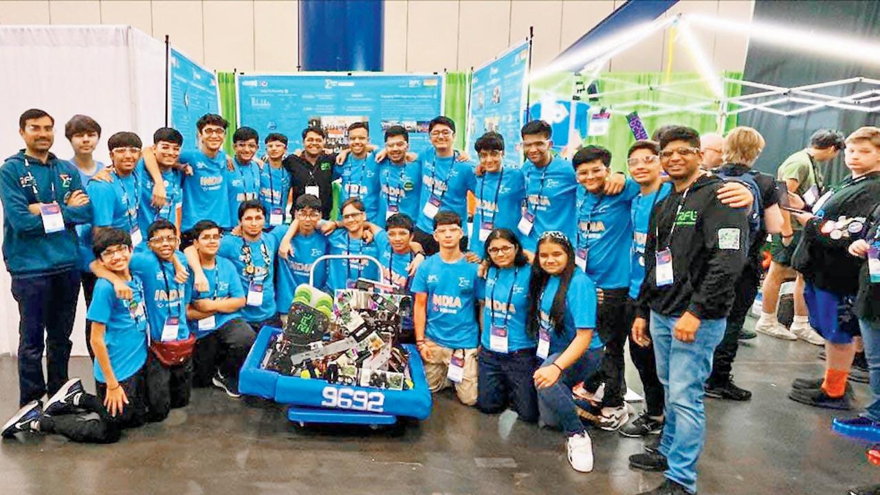 The team of students with their winning robot, Bot-Thoven (centre) in Houston