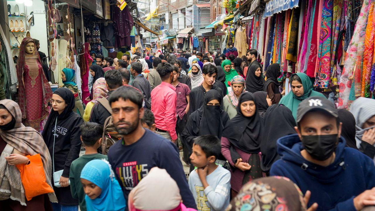 Muslims shop at a market for Eid-ul-Fitr, in Srinagar, Sunday. (PTI Photo)