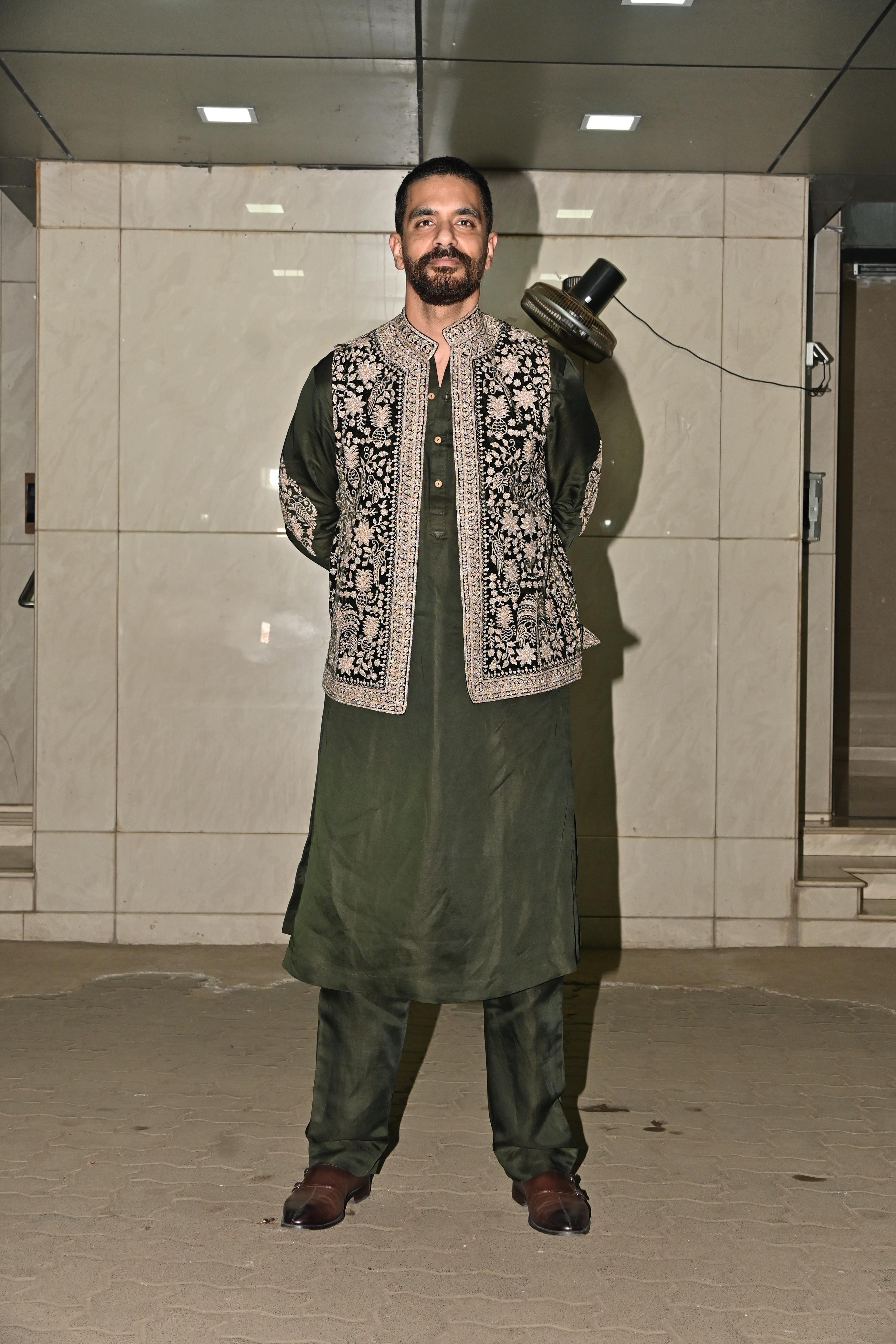Angad Bedi wore green kurta and churidar and paired it with intricate green jacket to ace his look at the party