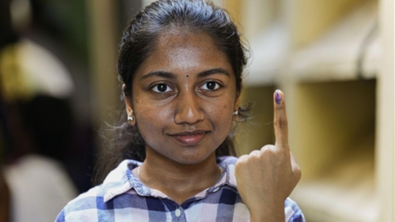 A first-time voter shows her ink-marked finger after casting vote/ PTI/ Representative Image