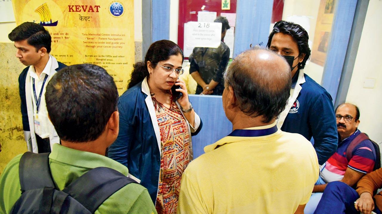 Kevats Apoorva Tiloda (extreme left) and Neha Desai dealing with crowds outside the counselling centre. Kevats also assist patients by coordinating between various departments at the hospital 
