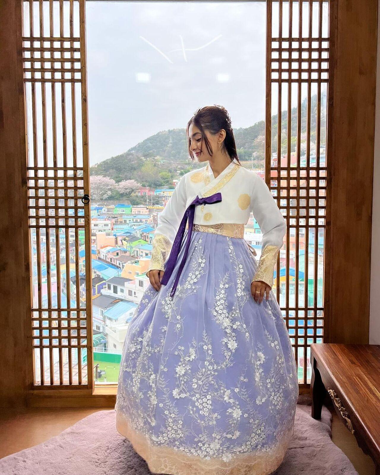 She has been sharing multiple pictures from her getaway, including this one wearing a Korean hanbok. 