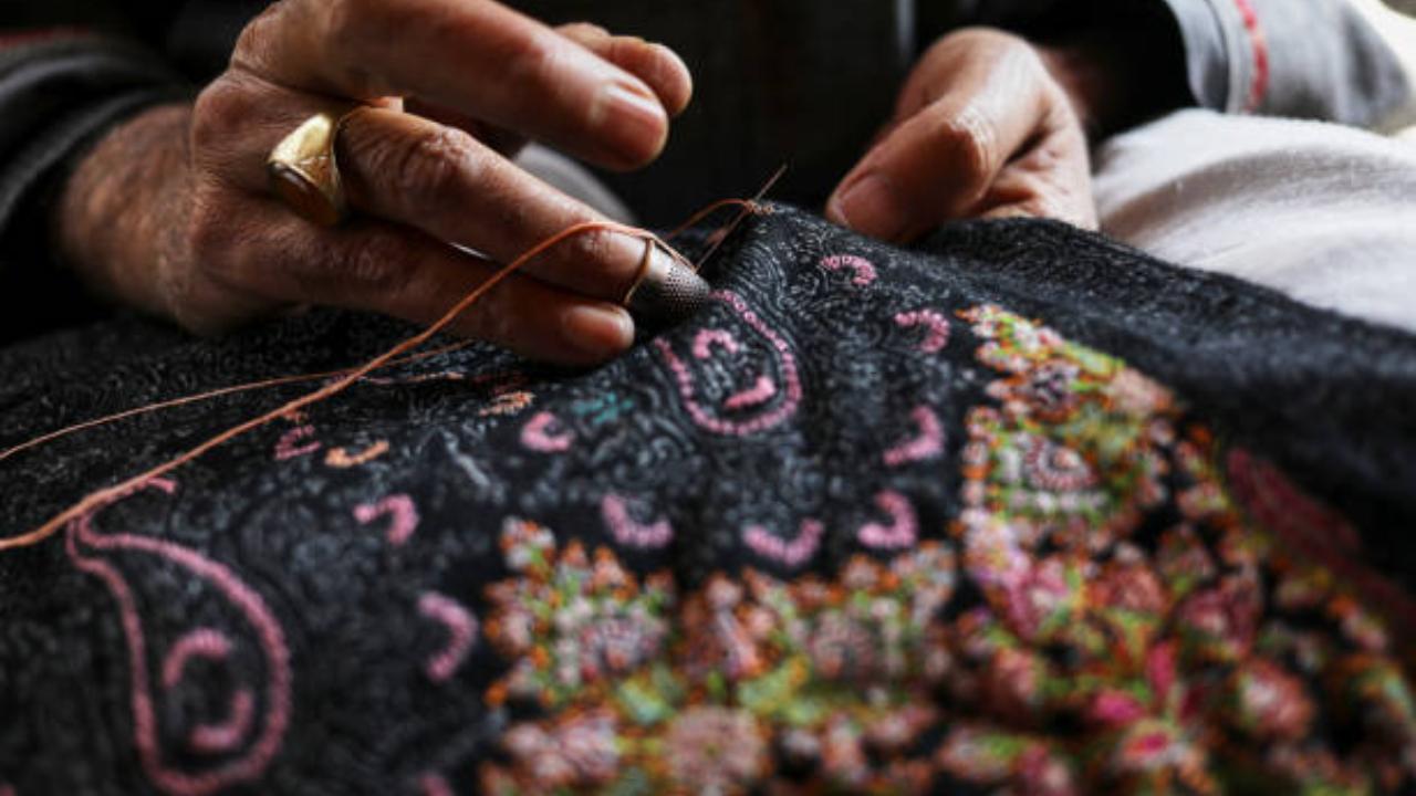 Pashmina Shawls: Renowned for their softness and warmth, Pashmina shawls are woven from fine cashmere wool in Kashmir and are prized for their intricate designs and craftsmanship