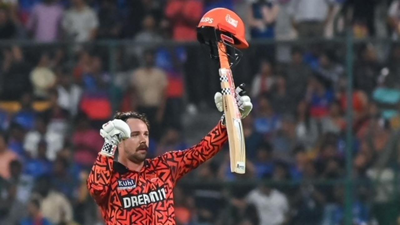 SRH`s Travis Head is ecstatic after scoring a century against RCB. Pic/AFP