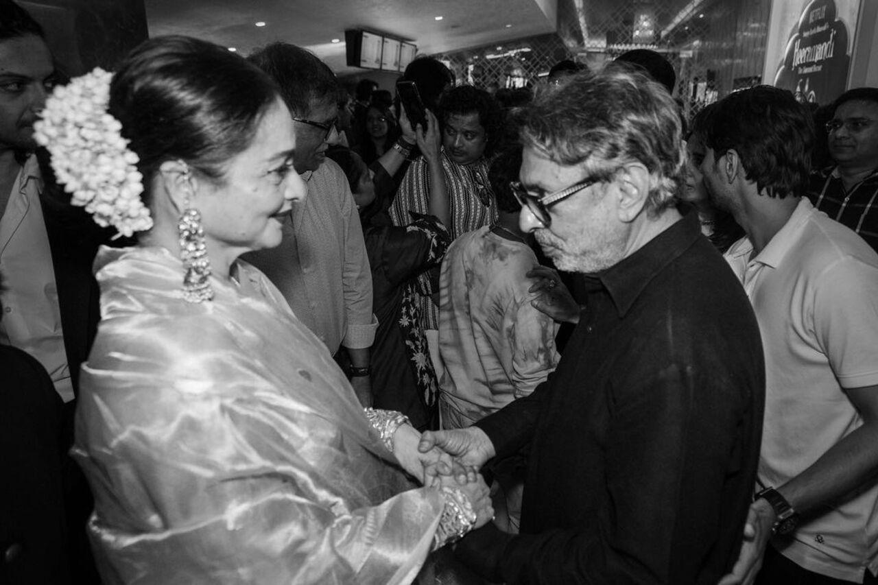 Rekha and Sanjay Leela Bhansali captured having a conversation at the premiere