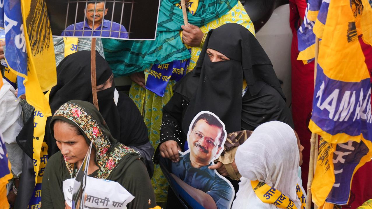  Supporters hold placards during jailed Delhi Chief Minister Arvind Kejriwal's wife Sunita Kejriwal's election roadshow in support of Aam Aadmi Party's (AAP) candidate from East Delhi. Pic/PTI