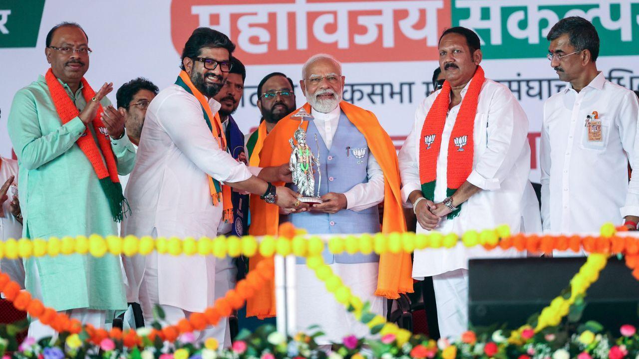 Prime Minister Narendra Modi being felicitated during a public meeting ahead of the Lok Sabha elections, in Satara, Maharashtra on Monday. (ANI Photo)