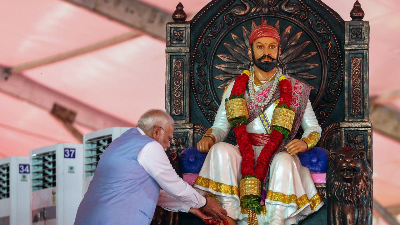 Prime Minister Narendra Modi pays tribute to Chhatrapati Shivaji Maharaj during a public meeting ahead of the Lok Sabha elections, in Satara, Maharashtra on Monday. (ANI Photo)