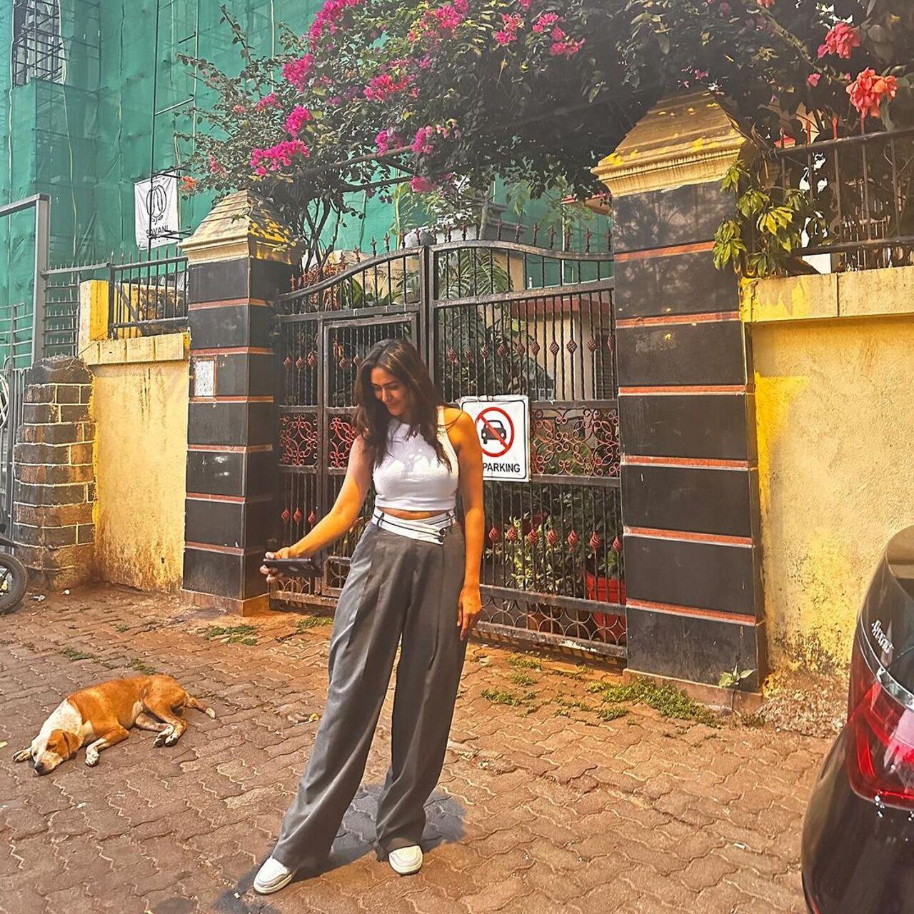 For her outing, Mrunal opted for a white crop top and grey trousers exuding chic summer vibes. 