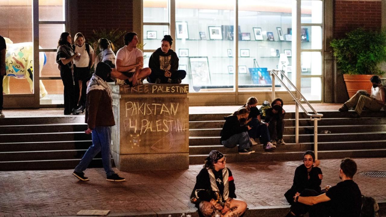 Demonstrators removed lightweight, bike rack-style barricades set up near the encampment and one person was escorted away by campus police, but they were not arrested, according to the university. (Photo by Kent Nishimura/GETTY IMAGES NORTH AMERICA/Getty Images via AFP)