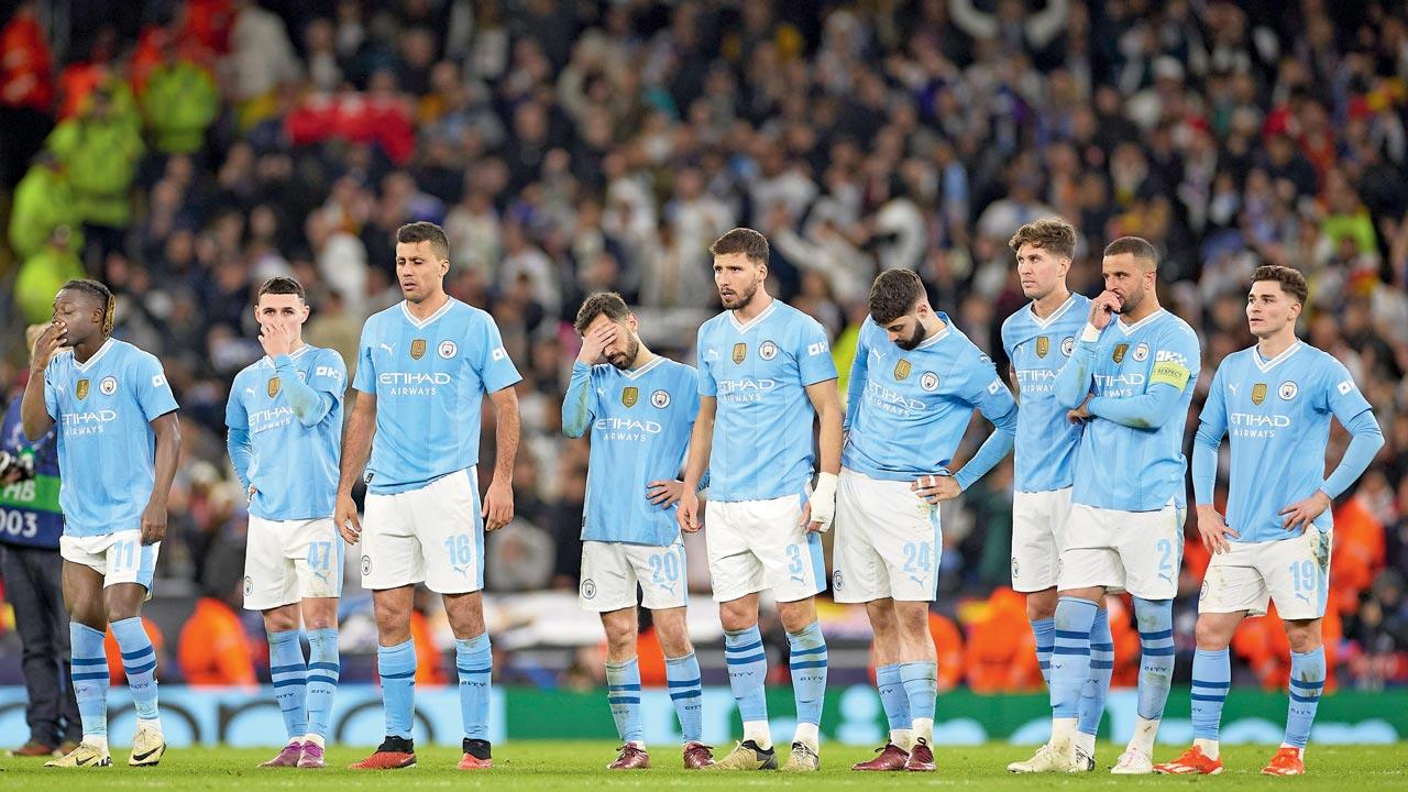 Manchester City players wear a dejected look at the end of the penalty shoot-out against Real Madrid