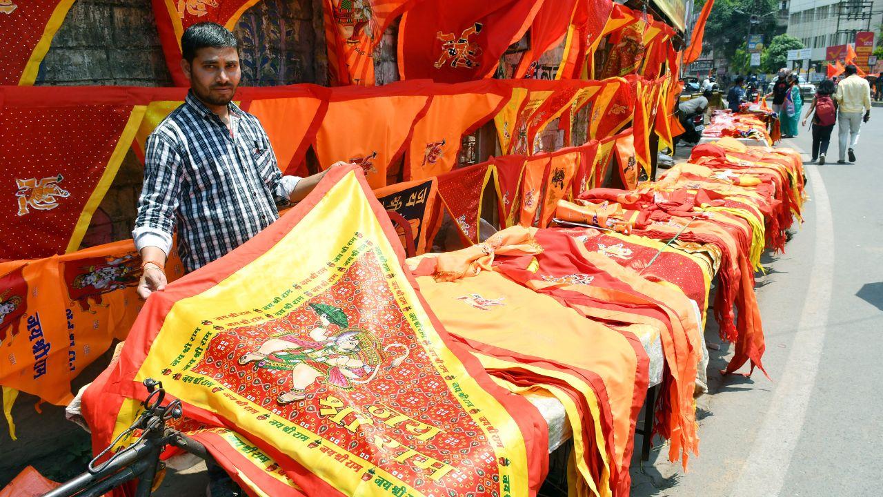 A vendor sells flags with 'Jai Shri Ram' written on it at a roasdside market ahead of Rama Navami festival, in Ranchi on Sunday. (ANI Photo)