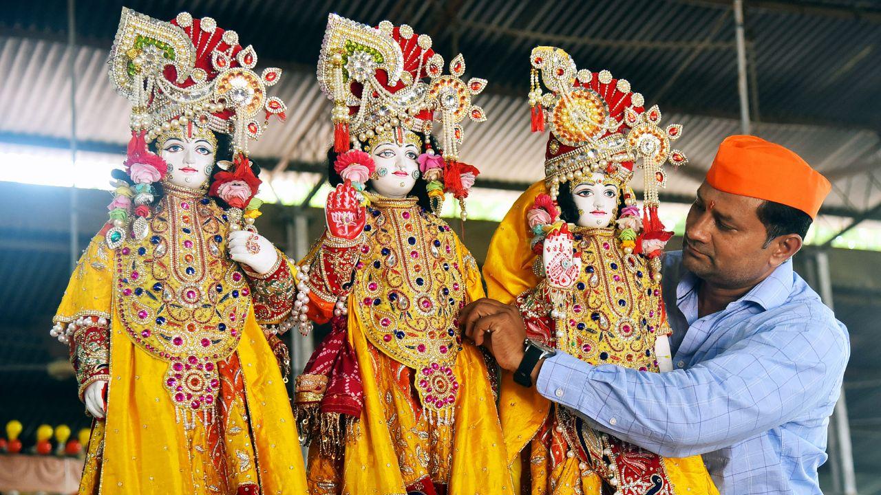 A man adjusts the ornaments adorning the idol of Lord Ram with Sita and Lakshman for the Shri Ram Janmotsav Shobhayatra (Rama Navami festival), in Nagpur on Monday. (ANI Photo)