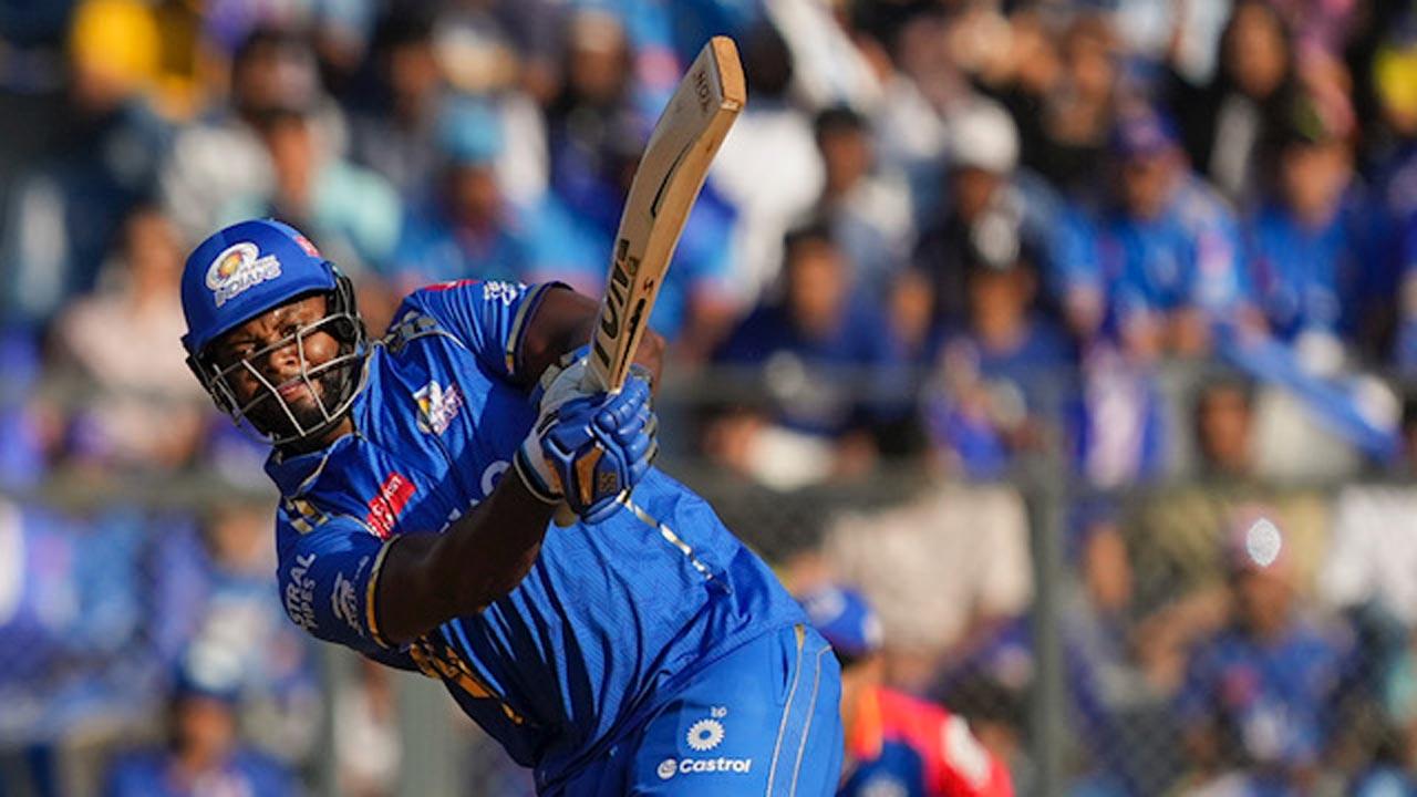 MI’s Romario Shepherd during his 39 not out against DC at Wankhede. Pic/PTI