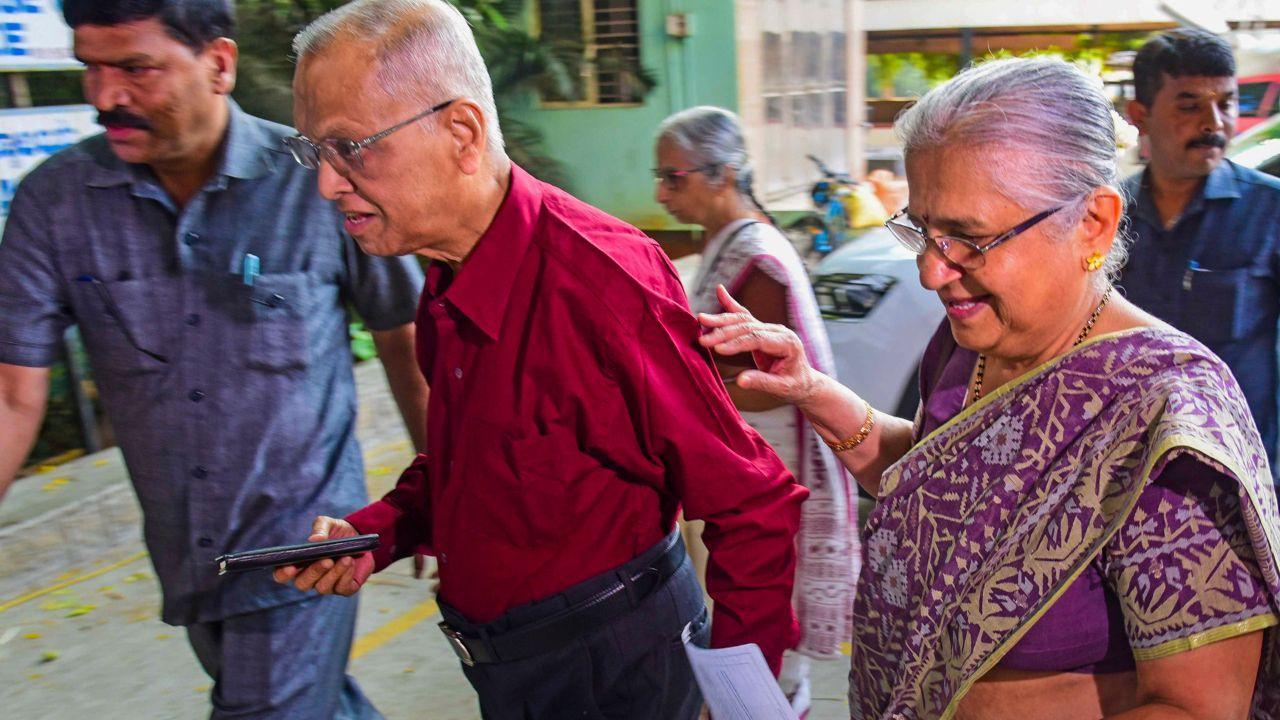Infosys co-founder N.R. Narayana Murthy and his wife Rajya Sabha MP Sudha Murty arrive at a polling station to cast their votes for the second phase of Lok Sabha elections, in Bengaluru, Friday, April 26, 2024. (PTI Photo)