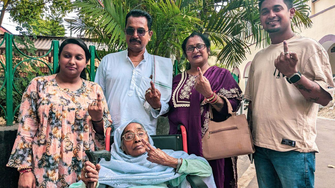Raj Dulari, an 86-year-old voter with her family show their ink-marked fingers after casting their vote for the second phase of the Lok Sabha elections 2024, at a polling station in Jammu on Friday. (ANI Photo)