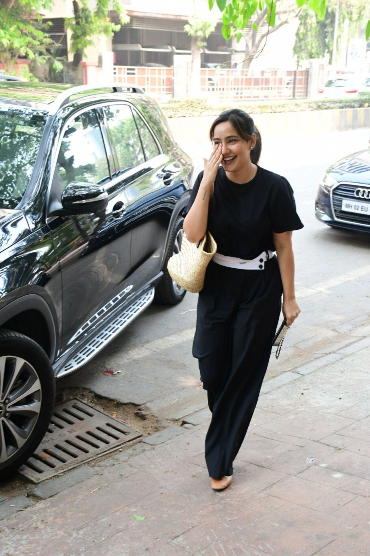Neha Sharma cannot stop giggling as she gets papped in the city