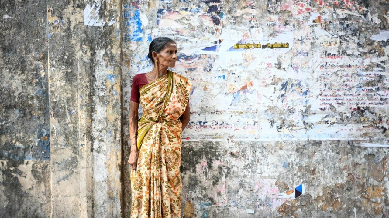 A woman looks on as she waits to cast her ballot to vote in the first phase of India's general election at a polling station in Chennai, capital of India's Tamil Nadu state on April 19, 2024 (Photo by R. Satish BABU/AFP)