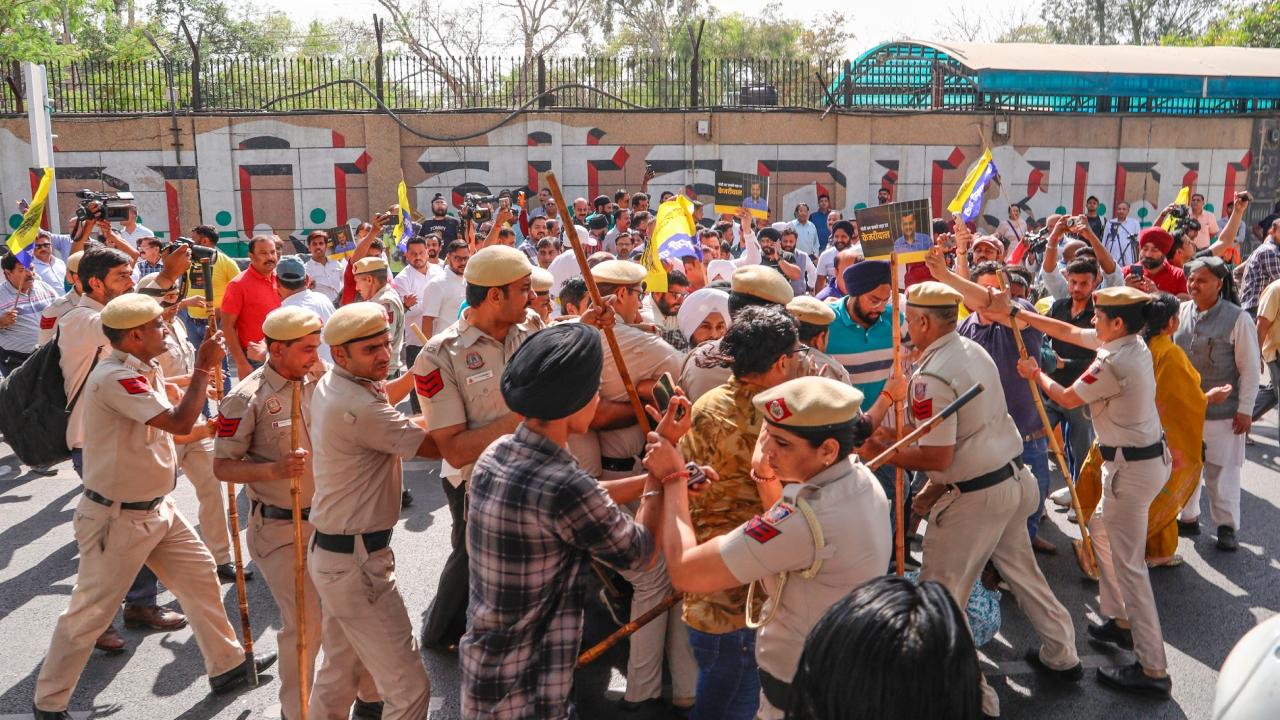 Scores of Aam Aadmi Party (AAP) workers, carrying party flags and wearing T-shirts with `Main Bhi Kejriwal` printed on them, gathered outside the jail entrance Scores of Aam Aadmi Party (AAP) workers, carrying party flags and wearing T-shirts with `Main Bhi Kejriwal` printed on them, gathered outside the jail entrance