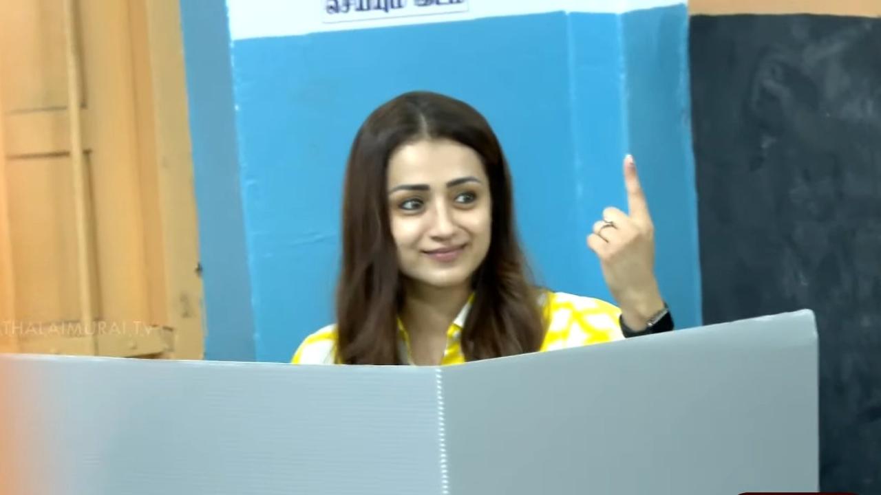 Trisha flaunts her finger as she casts her vote