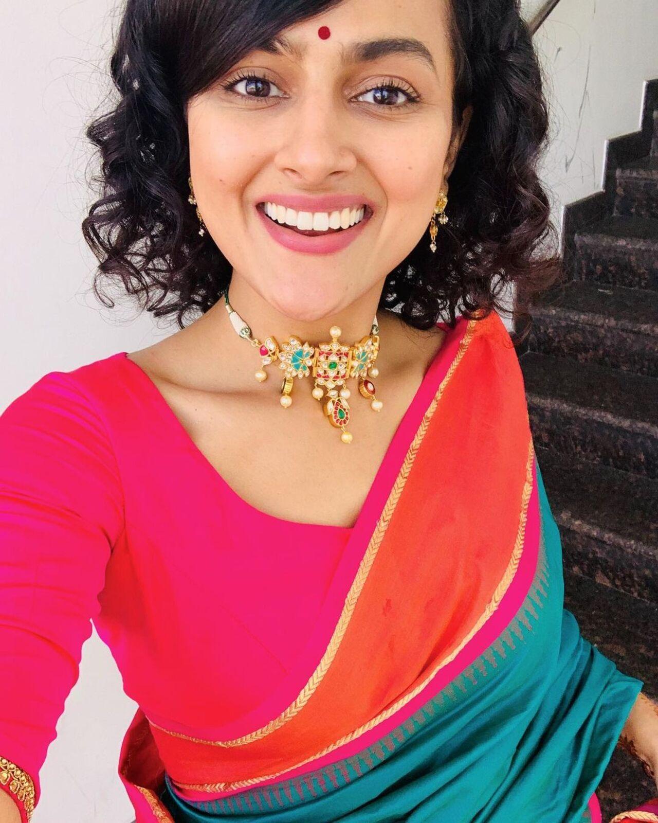 Go for the bold shades of pinks, oranges and green for a traditional feel like actress Shraddha Srinath. Top the look with a pearl choker and a simple bindi.