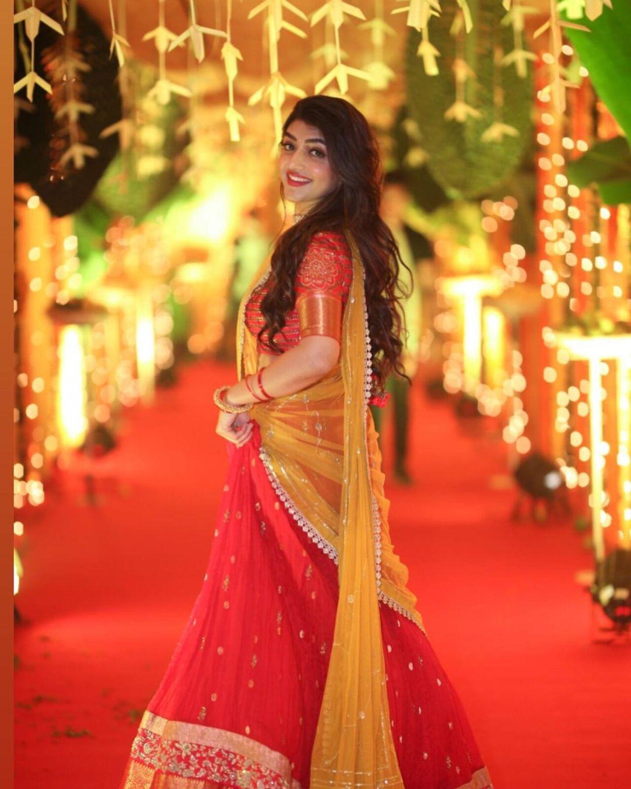Sreeleela shows the way in acing a half-saree. Opt for a flowy red skirt paired with a yellow dupatta that it will give off the ultimate festive vibes