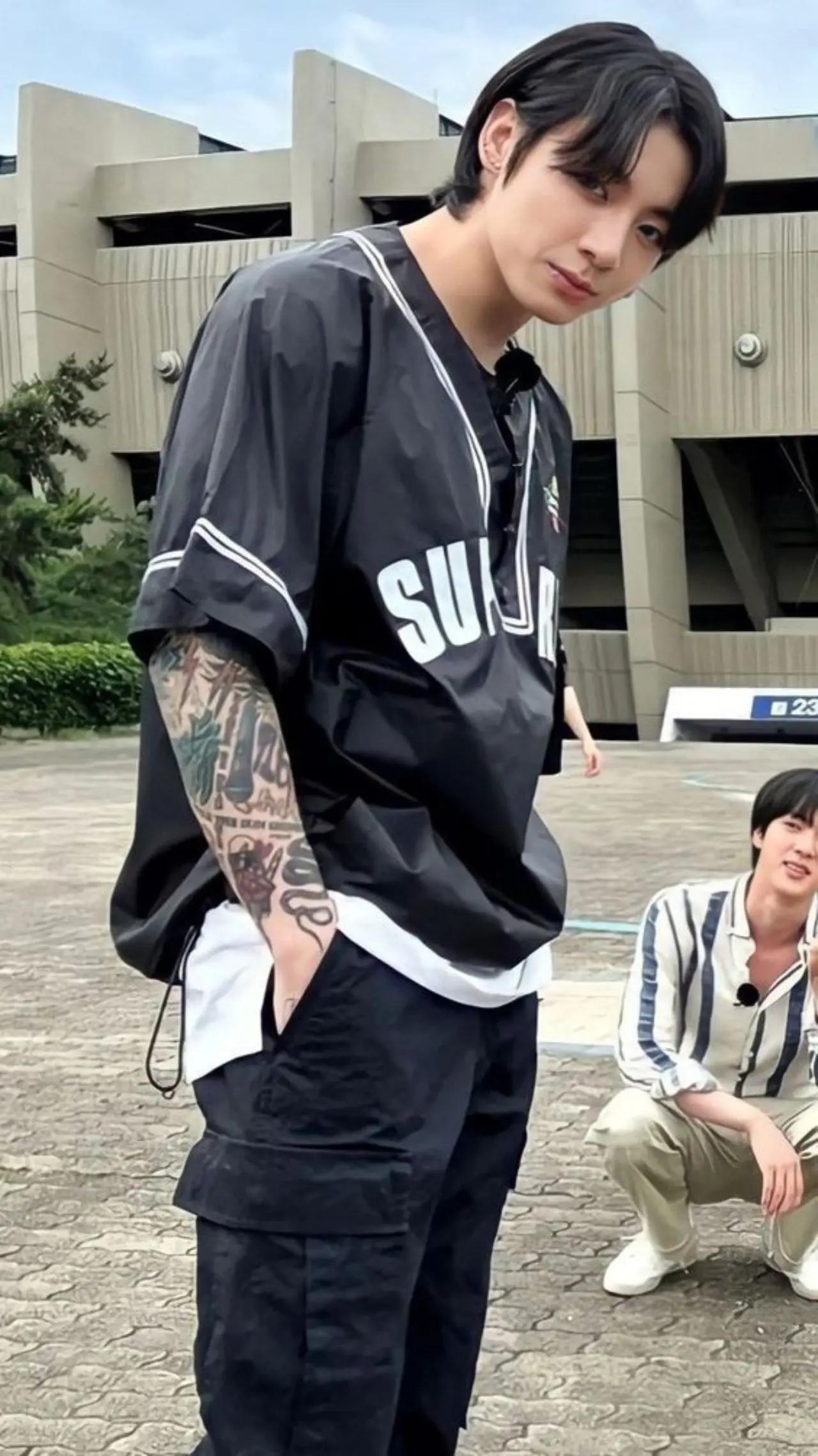  Jungkook's tattoos are all photo-worthy. On his right arm, one can spot three-striped lines, which fans have connected to what may seem like the Korean flag. Also, Jungkook had a golden-coloured eye tattoo which right below his elbow. He reportedly later replaced it with 'BULLETPROOF' lettering