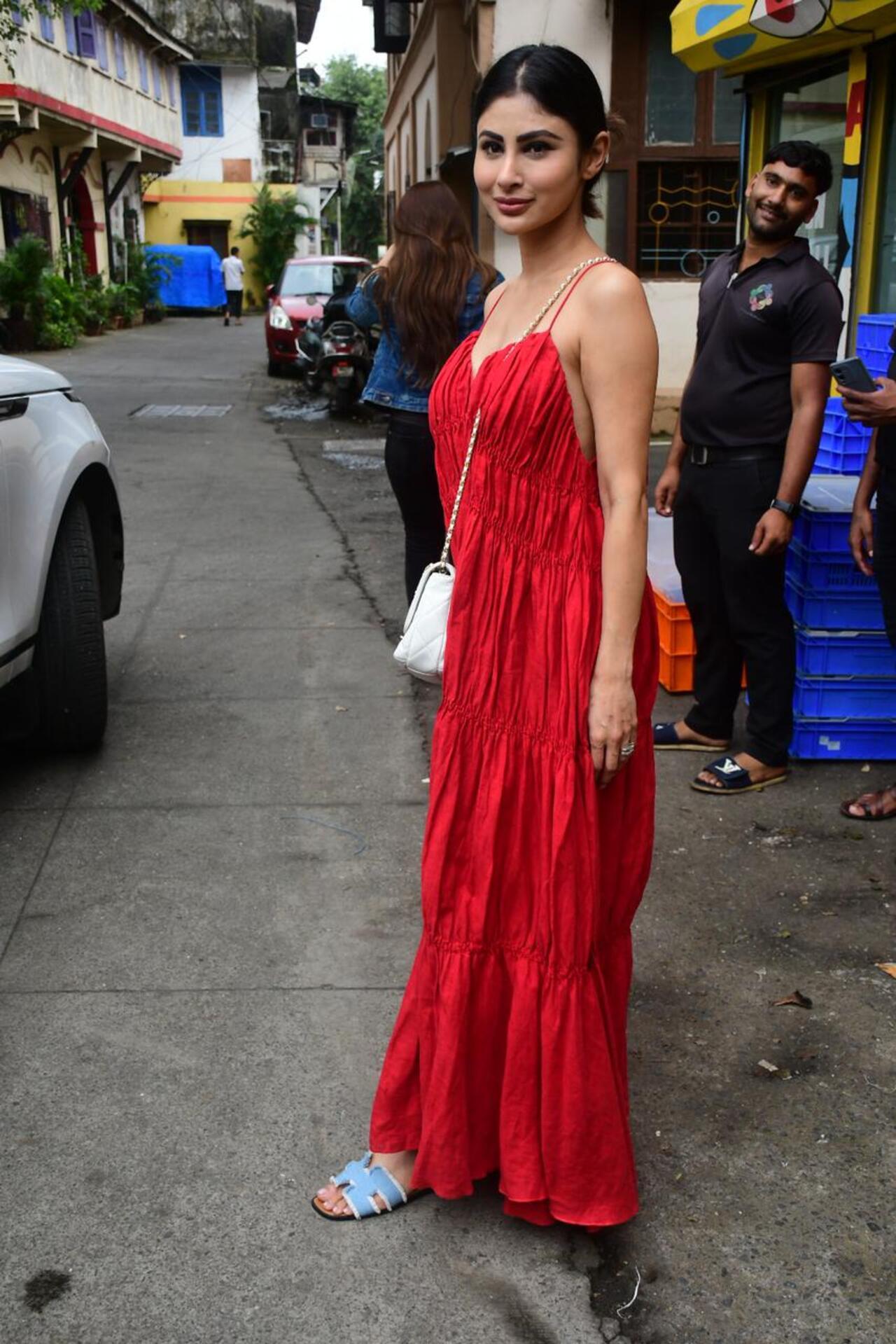 Mouni Roy was spotted at an eatery in town dressed in a simple red dress