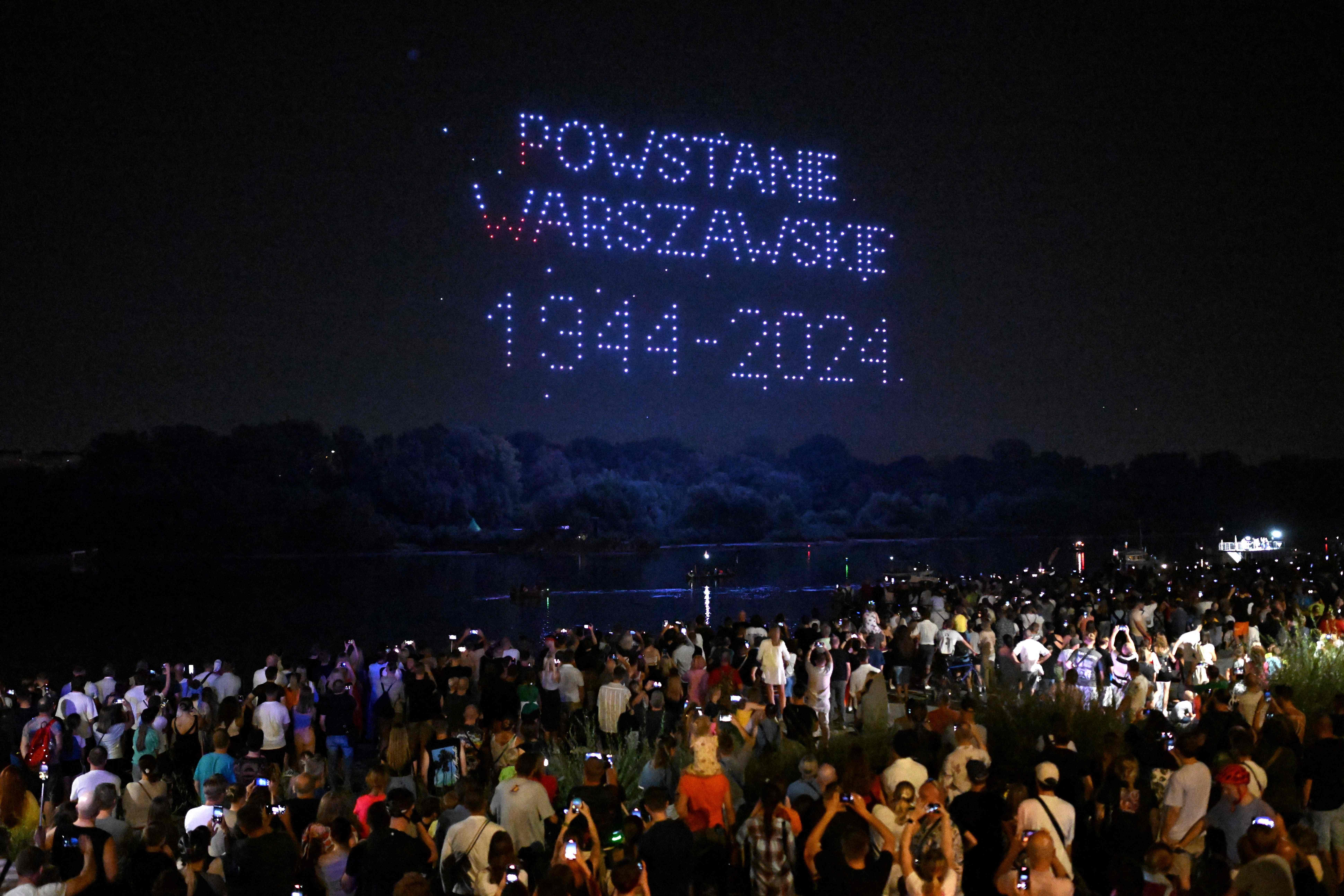 The uprising resulted in the deaths of around 16,000 Polish fighters and between 150,000 and 200,000 civilians. The drones form a pattern of words that read: 'Warsaw Uprising 1944-2024'