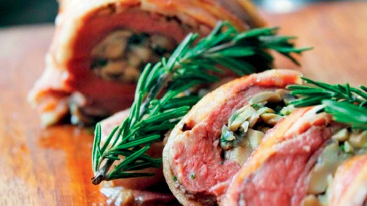 Bacon wrapped mushroom and stuffed tenderloin with bacon rosemary gravy made by Delzad Avari