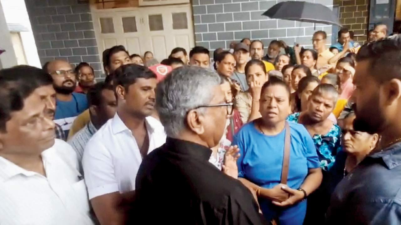 Stall owners protesting against the proposed rent hike and tendering system at the Basilica of Our Lady of the Mount on August 11