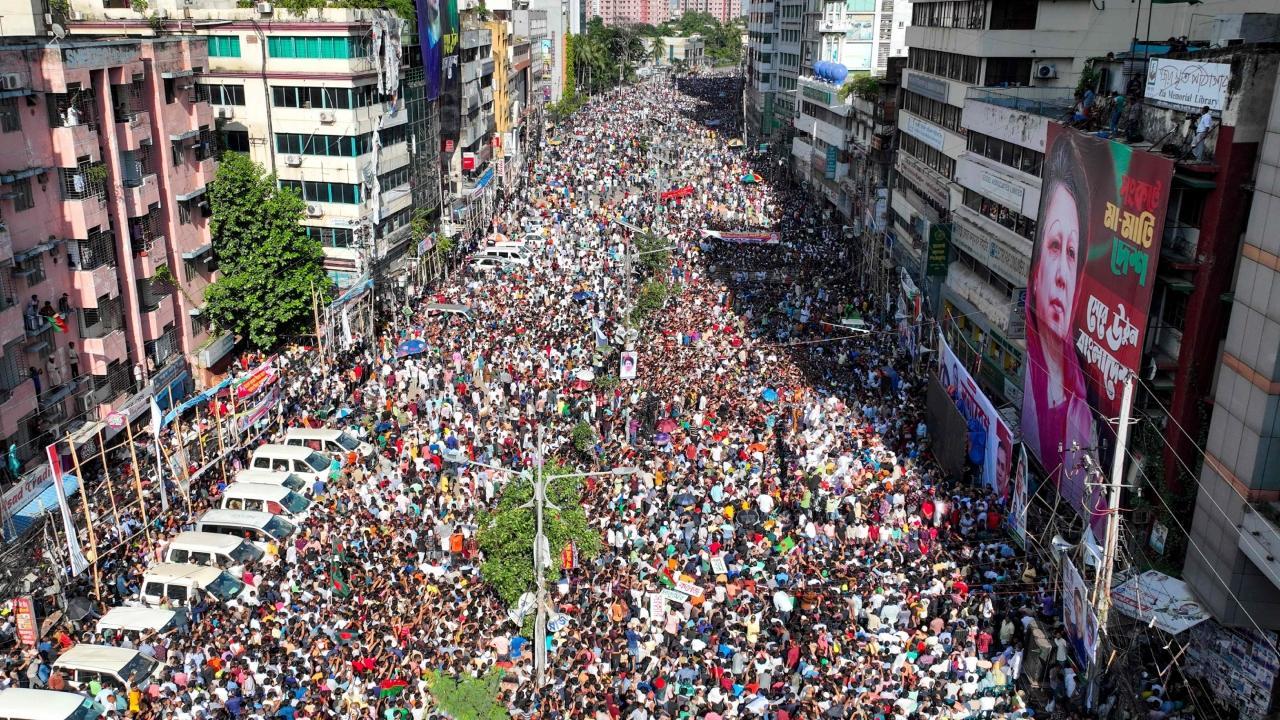 Bangladesh Nationalist Party (BNP) activists gather near a poster of BNP chairperson Khaleda Zia, during a rally in Dhaka on Wednesday. Pics/AFP