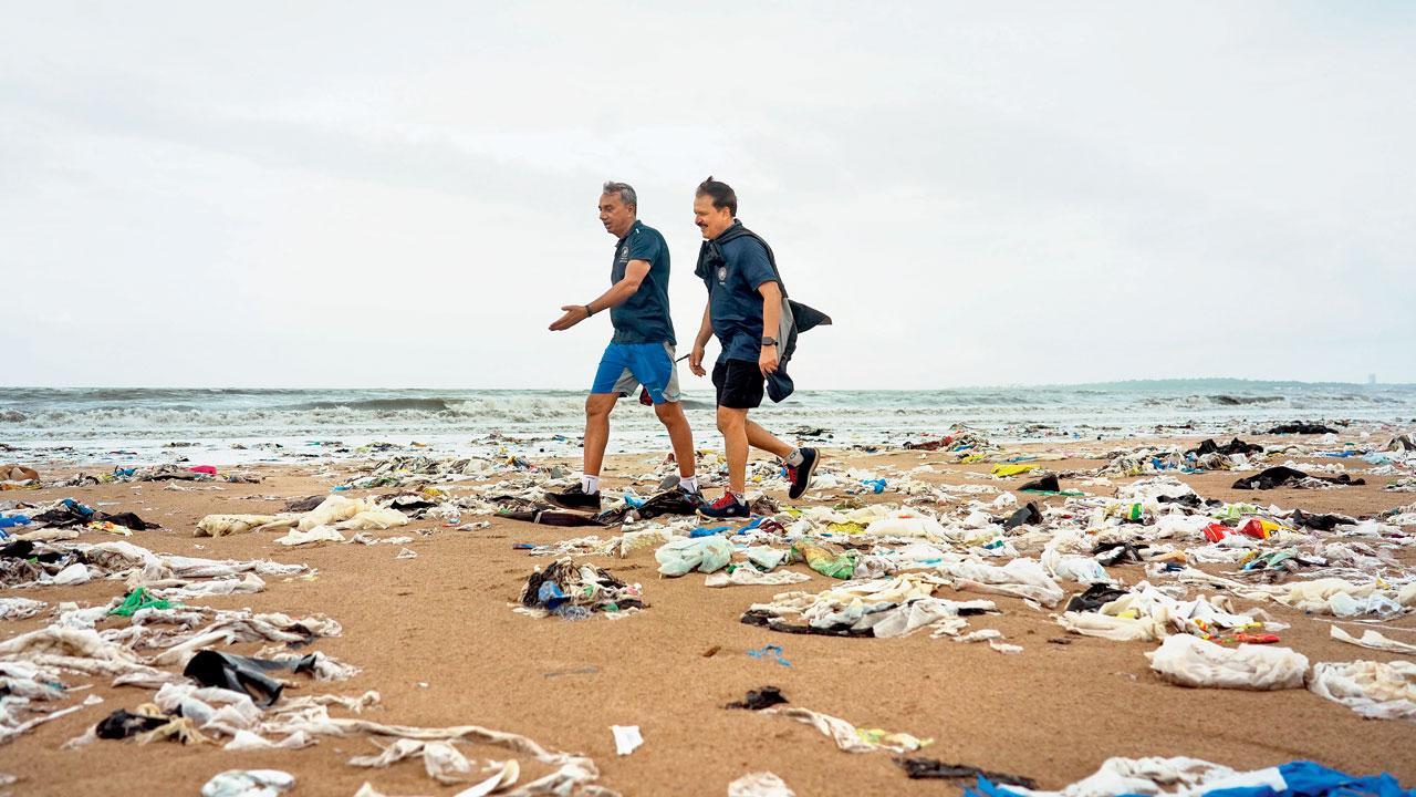 Morning walkers on a stretch covered in trash