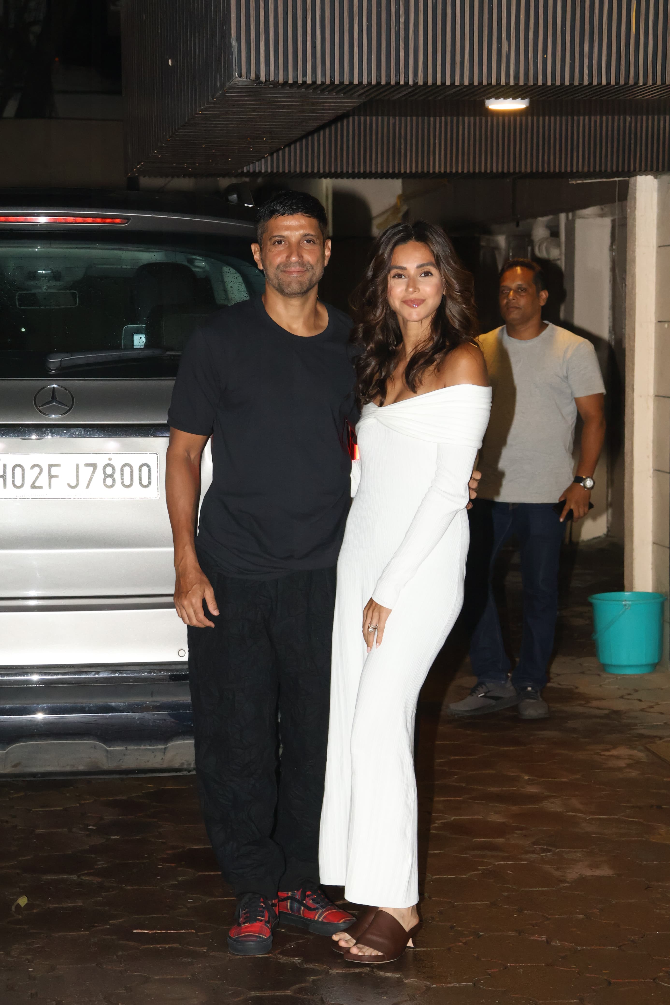 Shibani Dandekar made a stylish entry with her husband, Farhan Akhtar, at her birthday bash. She was seen wearing a stunning white jumpsuit, while Farhan kept it simple, letting the birthday girl shine