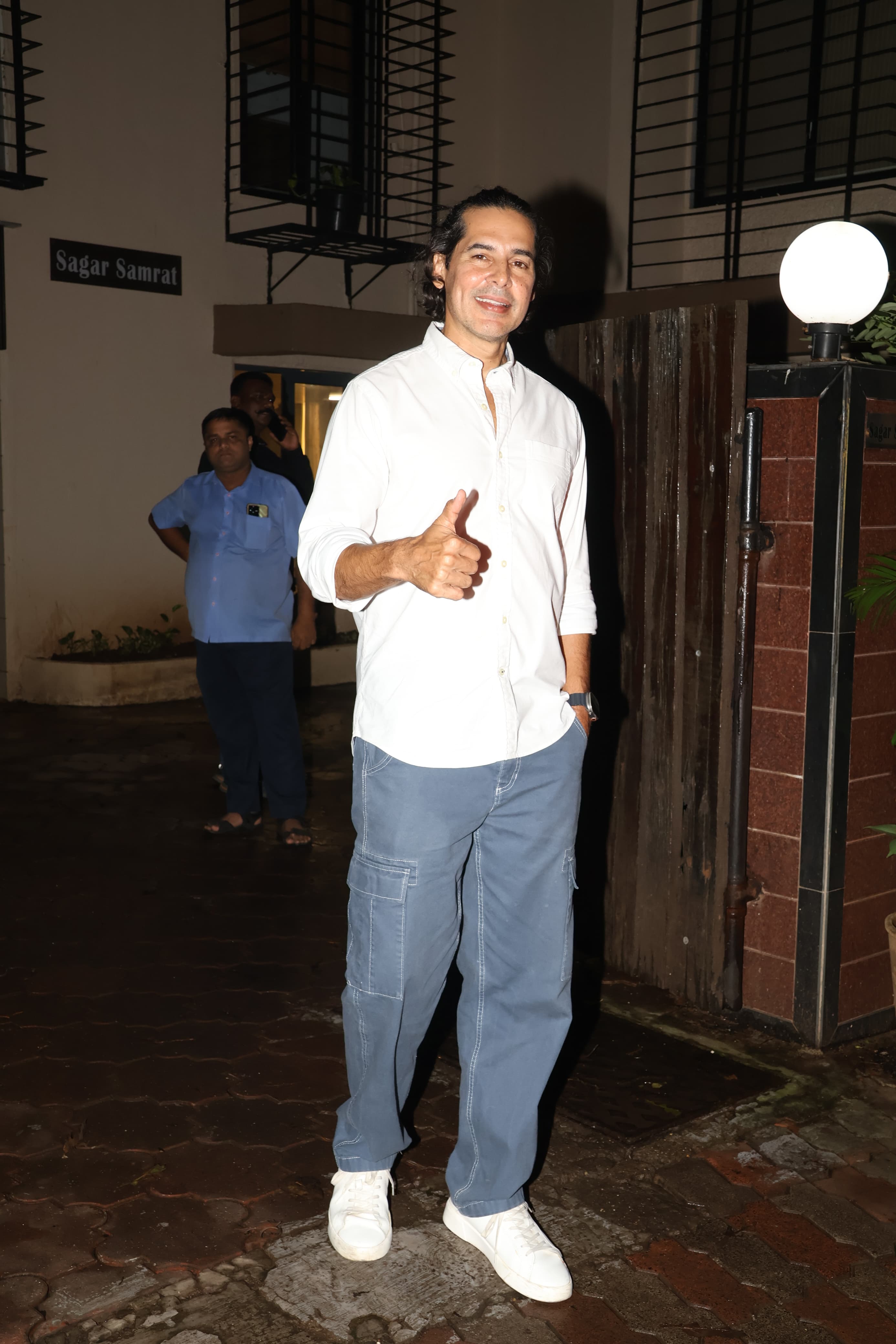 Dino Morea posed for the paparazzi as he attended Shibani Dandekar's birthday party