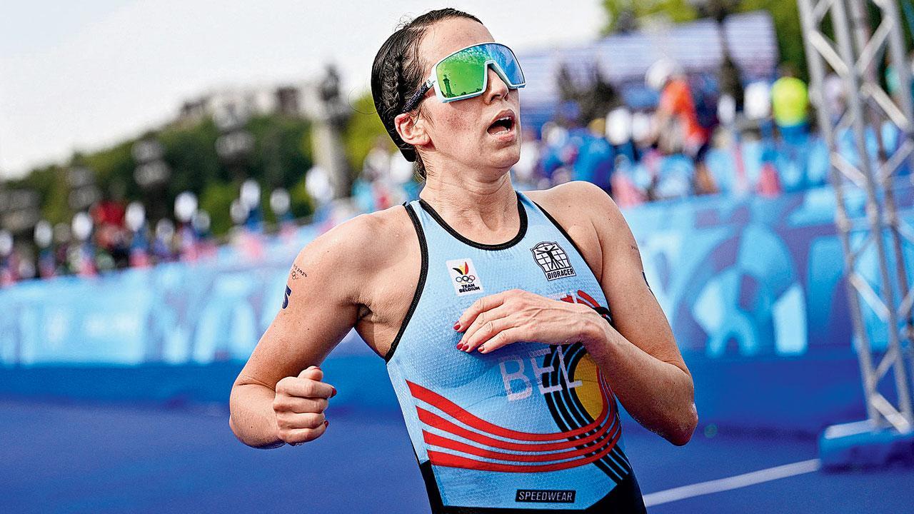 Triathlete Claire Michel says virus made her sick after swim in Seine, not E coli
