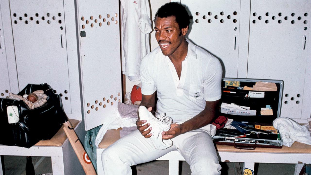West Indies fast bowler Colin Croft seems delighted to be in the Kensington Oval, Barbados, dressing room during the 1981 Test against England. PIC/GETTY IMAGES