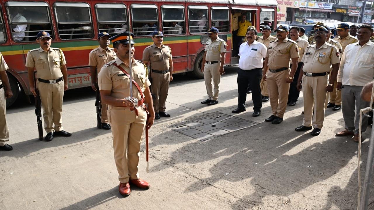 Mumbai Police personnel participate in the flag-hoisting ceremony in Goregaon